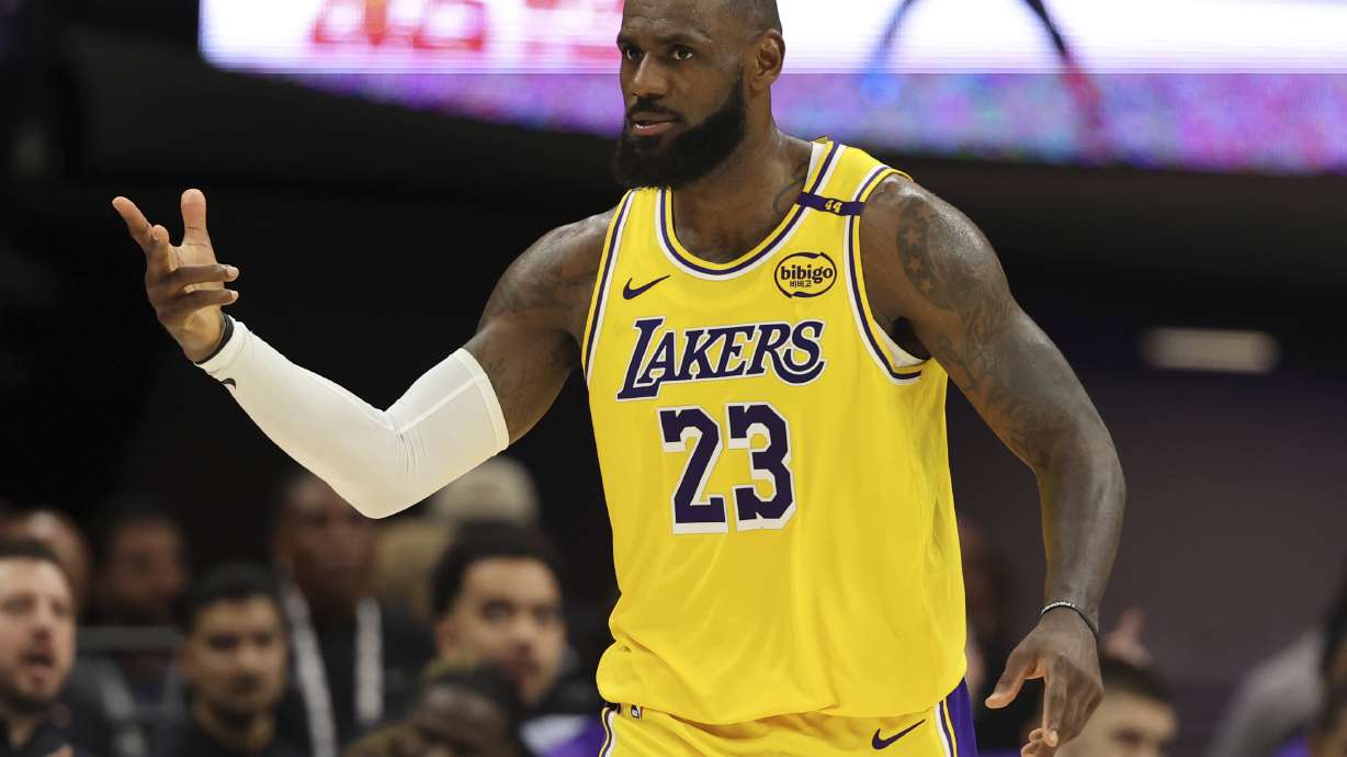 Los Angeles Lakers forward LeBron James (23) celebrates after scoring against the Sacramento Kings during the second half of an NBA basketball game in Sacramento, Calif., Thursday, Dec. 19, 2024.