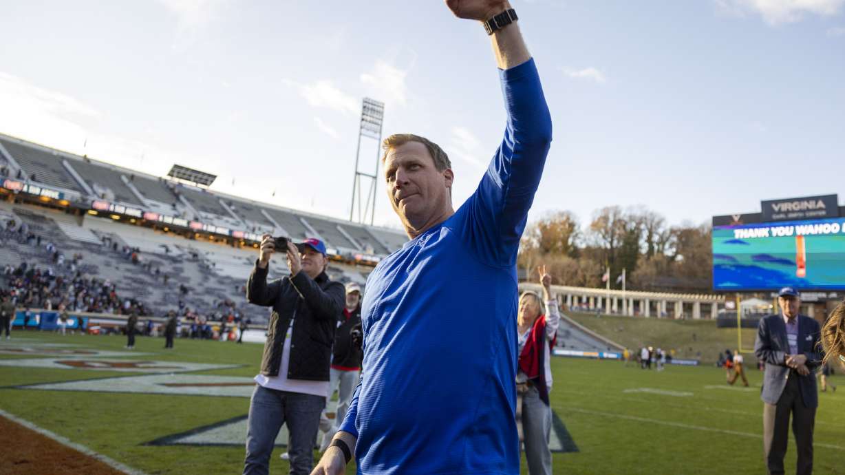 SMU head coach Rhett Lashlee celebrates after winning an NCAA college football game against Virginia Saturday, Nov. 23, 2024, in Charlottesville, Va.