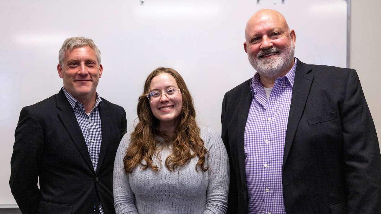 Jessa Wright poses for a photo with Brent Baum, right, and Jonathan Schwartz, left, chief executive officer and chief creative officer of FanX Studios, respectively.