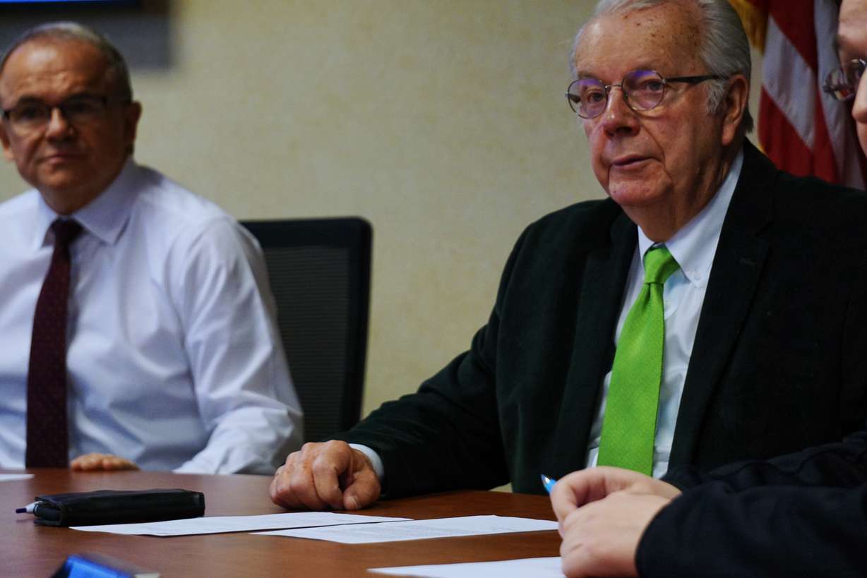 Robert Hunter and Kevin Eastman listen to public comment during a Webe Human Services board meeting Friday.
