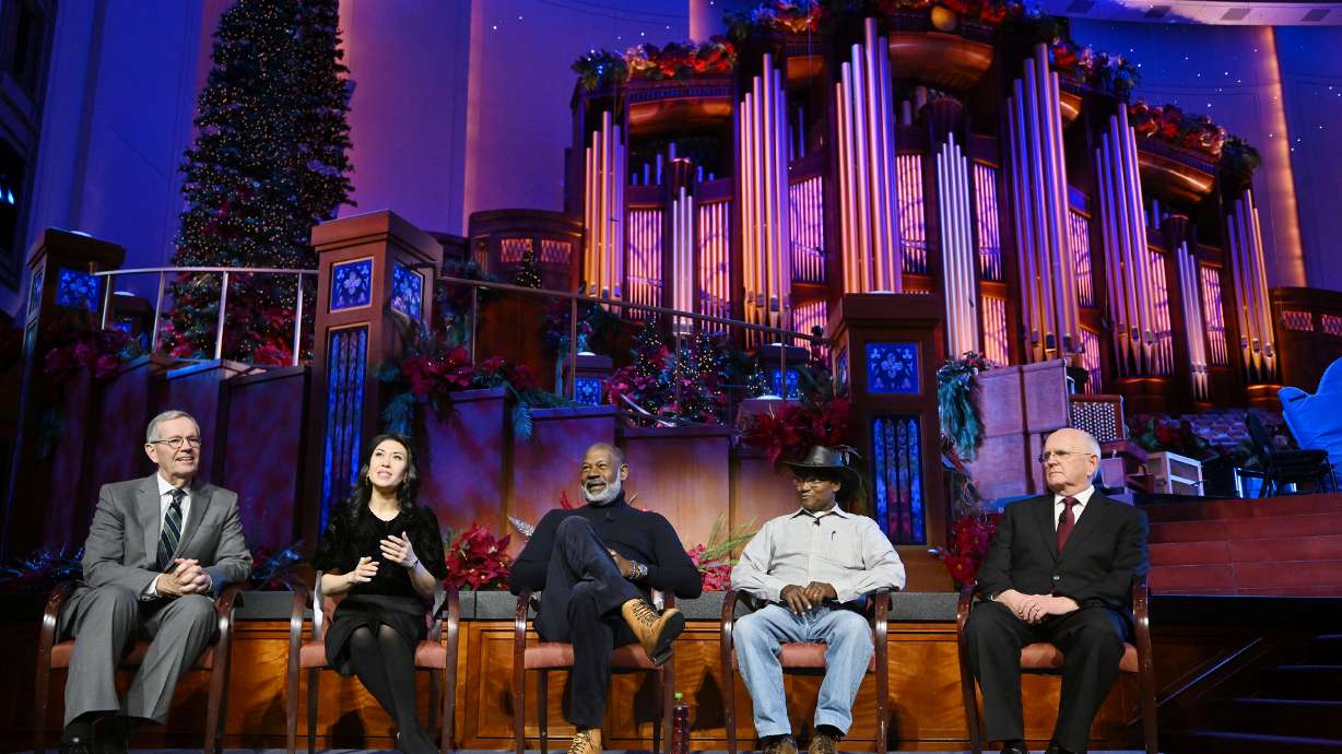 Mike Leavitt, president of the Tabernacle Choir at Temple Square and Mack Wilberg, choir music director, with Ruthie Ann Miles, Dennis Haysbert and Charles Mulli at the Conference Center in Salt Lake City on Friday.