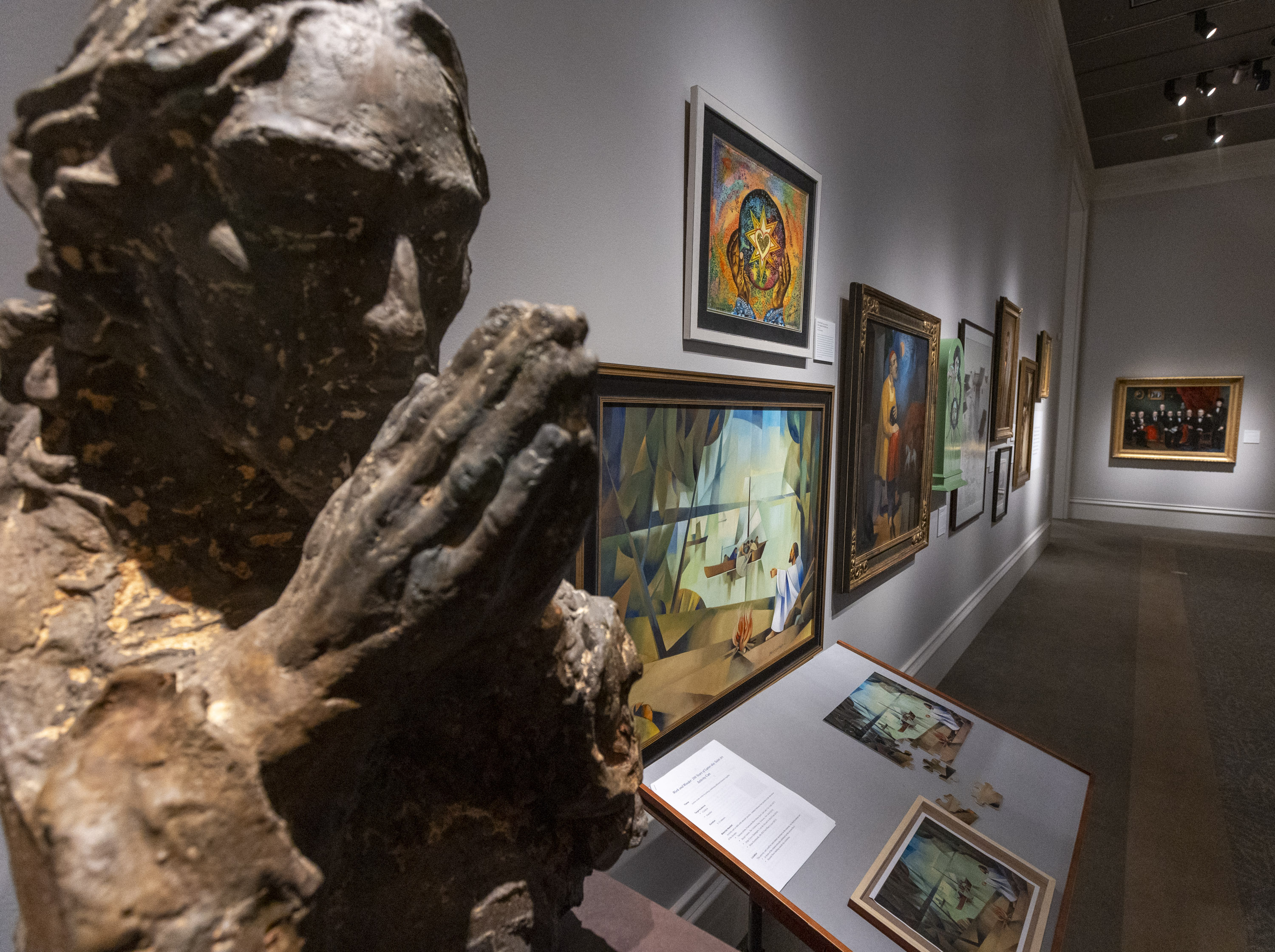 A collection of works is displayed at an exhibition at the Church History Museum in Salt Lake City on Sept. 30. A woman was arrested Friday for allegedly damaging a tapa cloth in the museum.