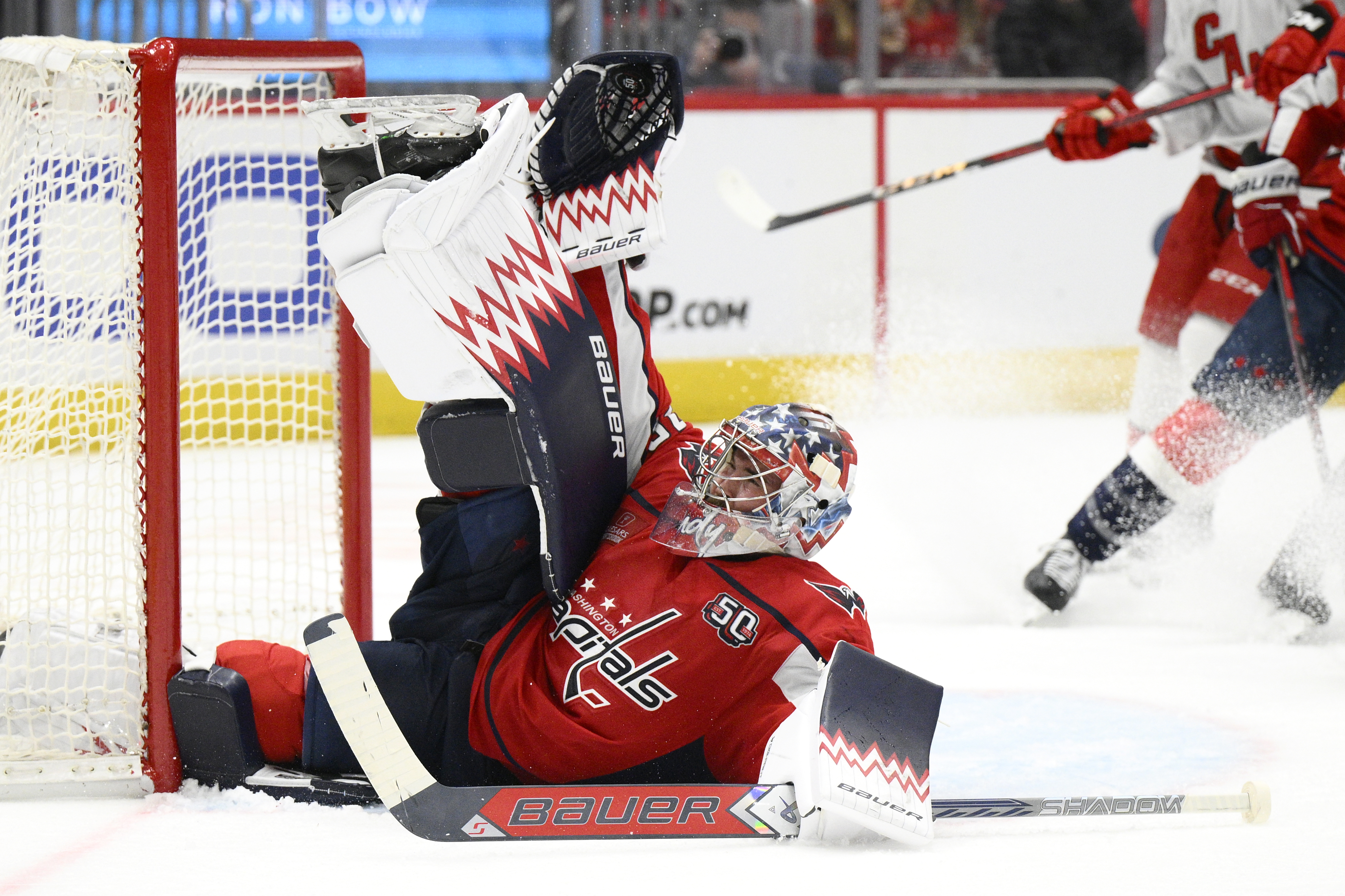 Washington Capitals goaltender Charlie Lindgren saves the puck during the second period of an NHL hockey game against the Carolina Hurricanes, Friday, Dec. 20, 2024, in Washington.