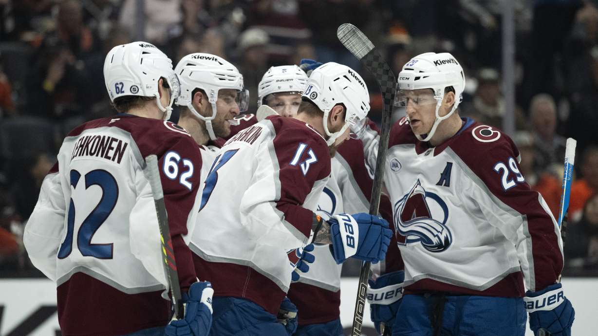 Colorado Avalanche players celebrate after a goal by right wing Valeri Nichushkin (13) during the second period of an NHL hockey game against the Anaheim Ducks, Friday, Dec. 20, 2024, in Anaheim, Calif.