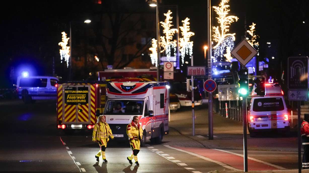 Emergency services work in a cordoned-off area near a Christmas Market, after a car drove into a crowd in Magdeburg, Germany, Saturday.