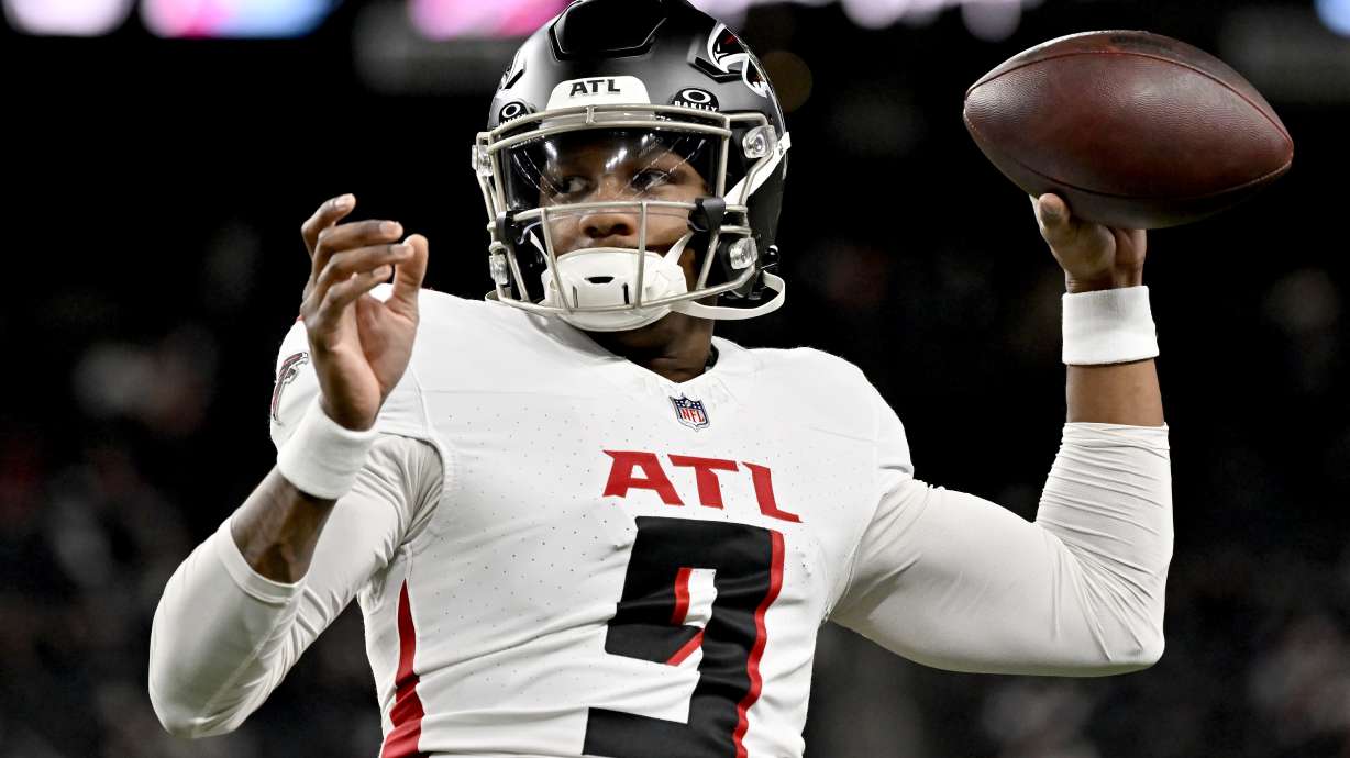 FILE - Atlanta Falcons quarterback Michael Penix Jr. warms up prior to an NFL football game against the Las Vegas Raiders, Monday, Dec. 16, 2024, in Las Vegas.