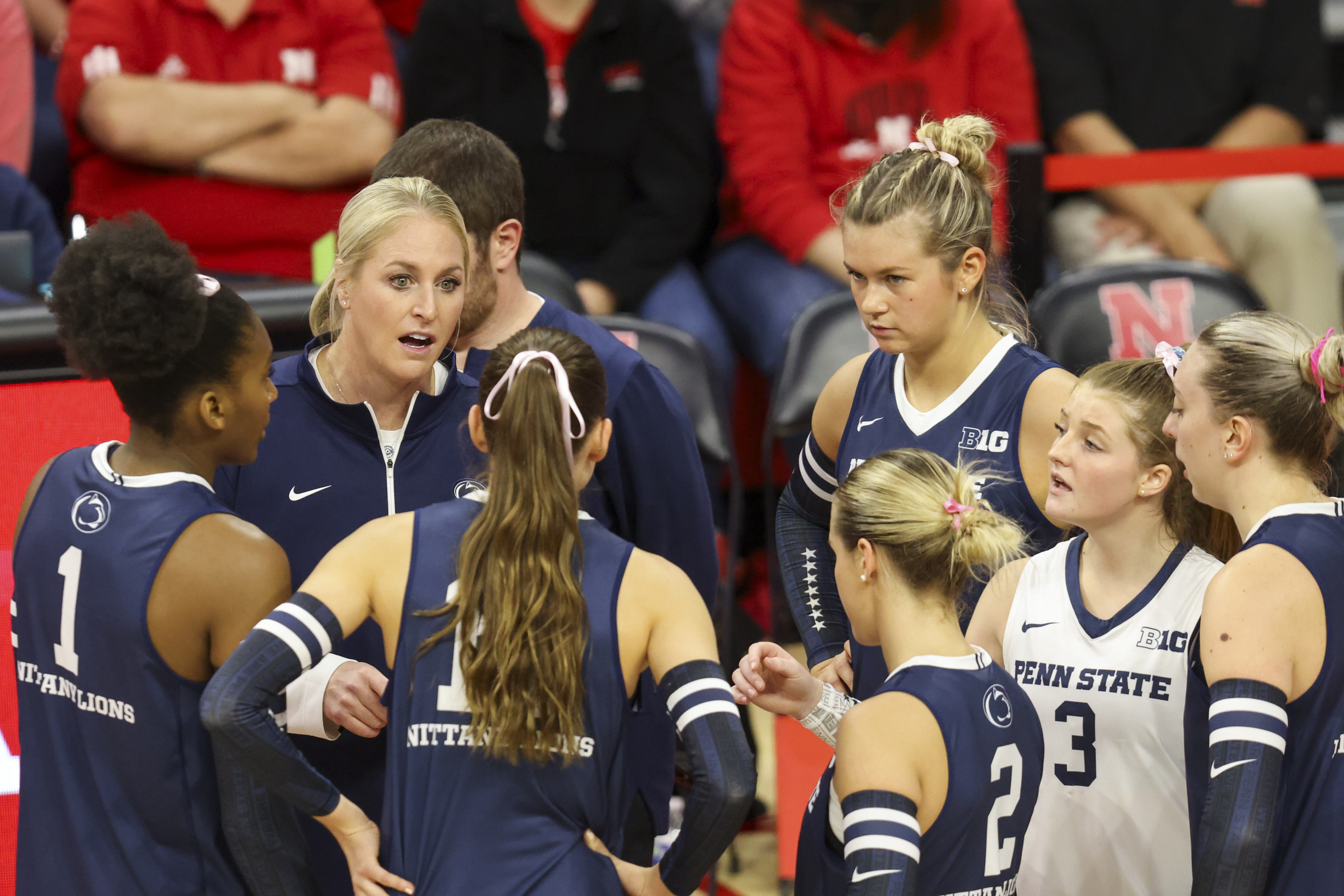 FILE -Penn State head coach Katie Schumacher-Cawley, second from left, talks with her team during a timeout during the first set of an NCAA college volleyball match against Nebraska, Saturday, Oct. 14, 2023, in Lincoln, Neb.