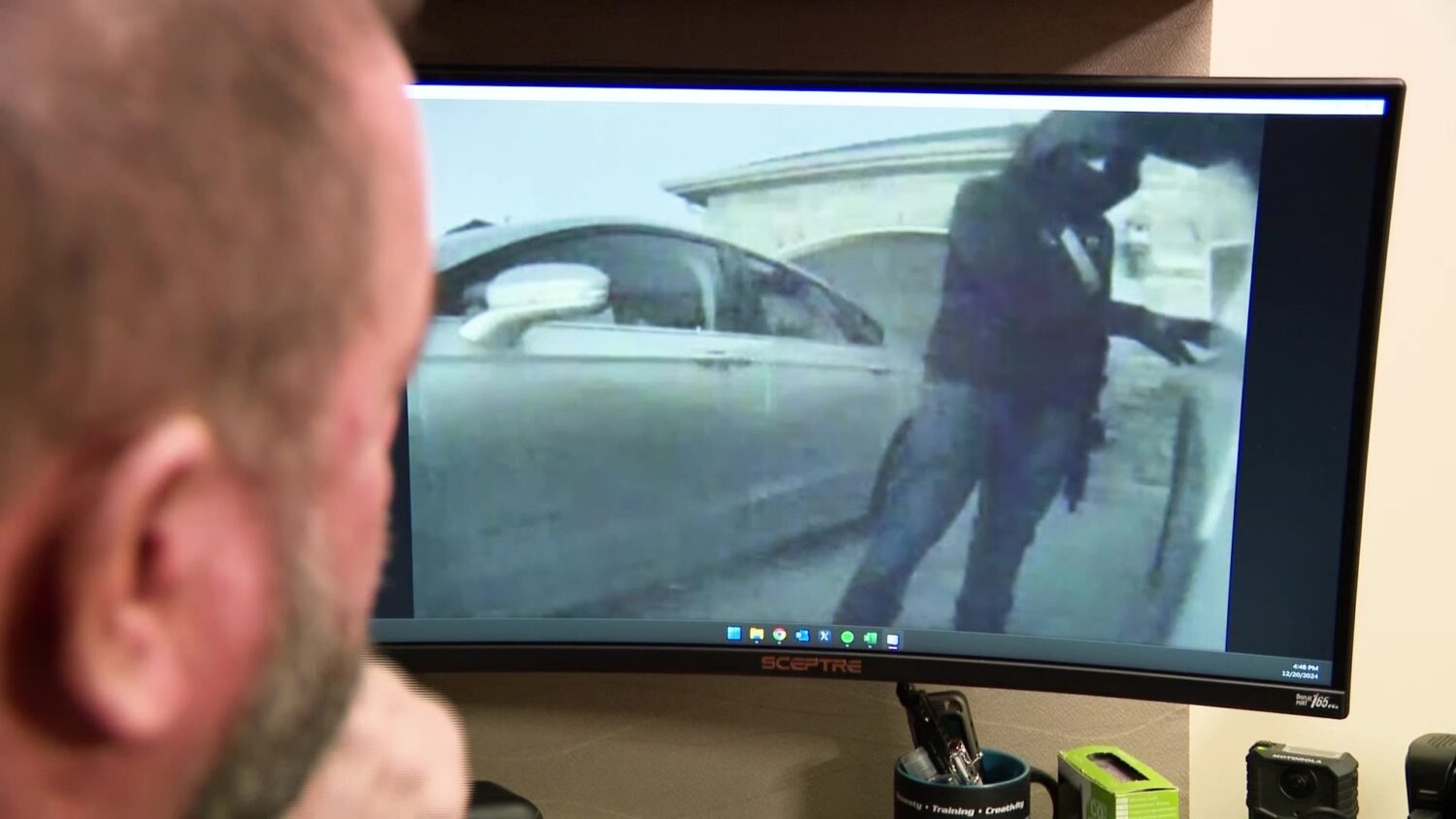 North Salt Lake Deputy Police Chief Mitch Gwilliam is reviewing the security footage of an armed man trying to enter a North Salt Lake car Friday.