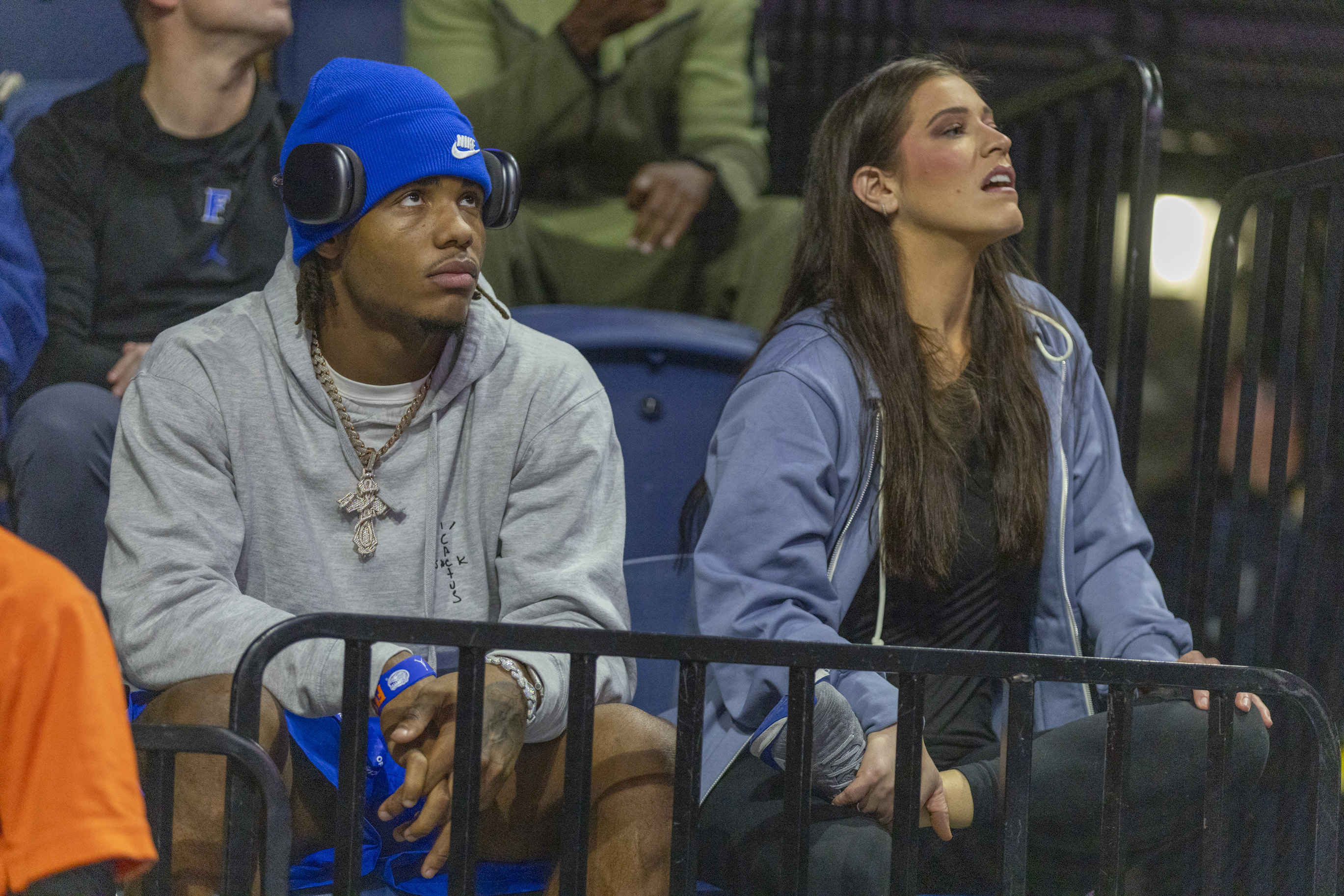 Former Oregon football signee Dallas Wilson, left, attends a Florida basketball game against North Florida Saturday, Dec. 21, 2024, in Gainesville, Fla. Wilson, a five-star receiver is considering signing with the Florida. 