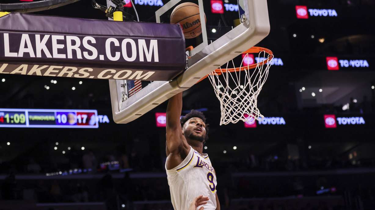 Los Angeles Lakers guard Bronny James catches a rebound during the second half of an NBA basketball game against the Trail Blazers, Sunday, Dec. 8, 2024, in Los Angeles.