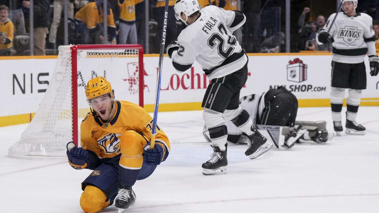 Nashville Predators defenseman Nick Blankenburg (37) celebrates his game winning goal against the Los Angeles Kings at the end of overtime of an NHL hockey game Saturday, Dec. 21, 2024, in Nashville, Tenn. The Predators won 3-2.
