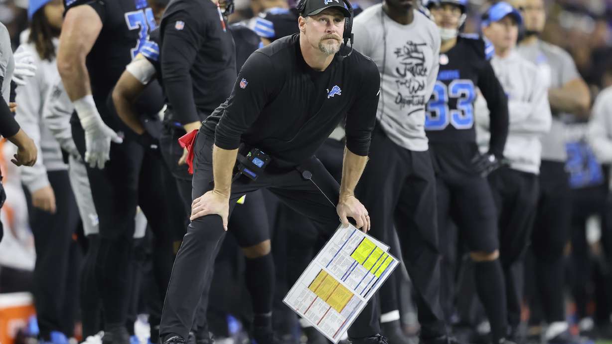 Detroit Lions head coach Dan Campbell, foreground, watches from the sideline during the first half of an NFL football game against the Buffalo Bills, Sunday, Dec. 15, 2024, in Detroit.