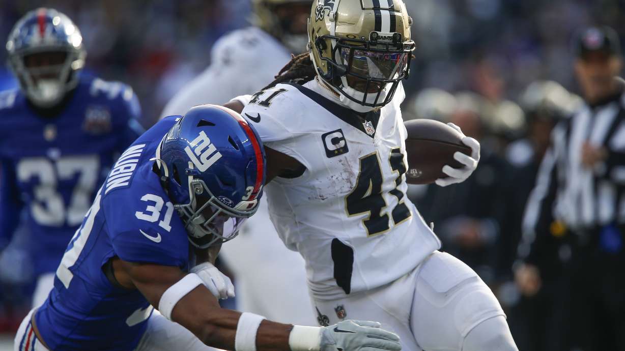 New Orleans Saints running back Alvin Kamara (41) carries the ball against New York Giants safety Tyler Nubin (31) during the second quarter of an NFL football game, Sunday, Dec. 8, 2024, in East Rutherford, N.J.