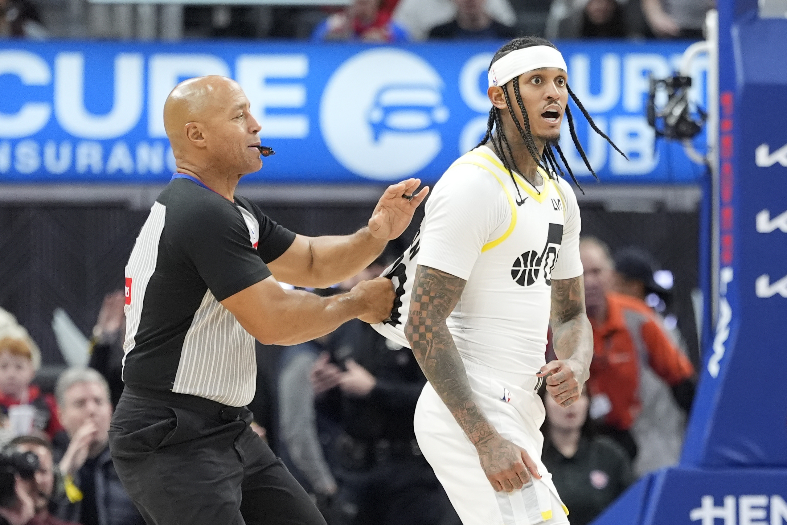 Utah Jazz guard Jordan Clarkson (00) gets into a stance with Detroit Pistons forward Ronald Holland II during the second half of an NBA basketball game, Thursday, Dec. 19, 2024, in Detroit. Both Clarkson and Holland were ejected.