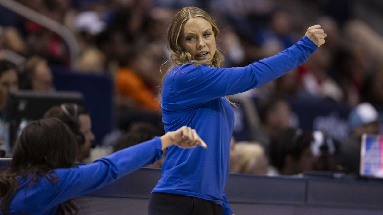 BYU head coach Amber Whiting talks with another member of coaching staff during a game between BYU and the Arizona Wildcats at the J. Willard Marriott Center on the campus of Brigham Young University in Provo on Saturday, Dec. 21, 2024.