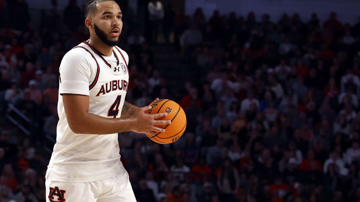 Auburn forward Johni Broome dribbles the ball during the first half of an NCAA college basketball game against Purdue, Saturday, Dec. 21, 2024, in Birmingham, Ala.