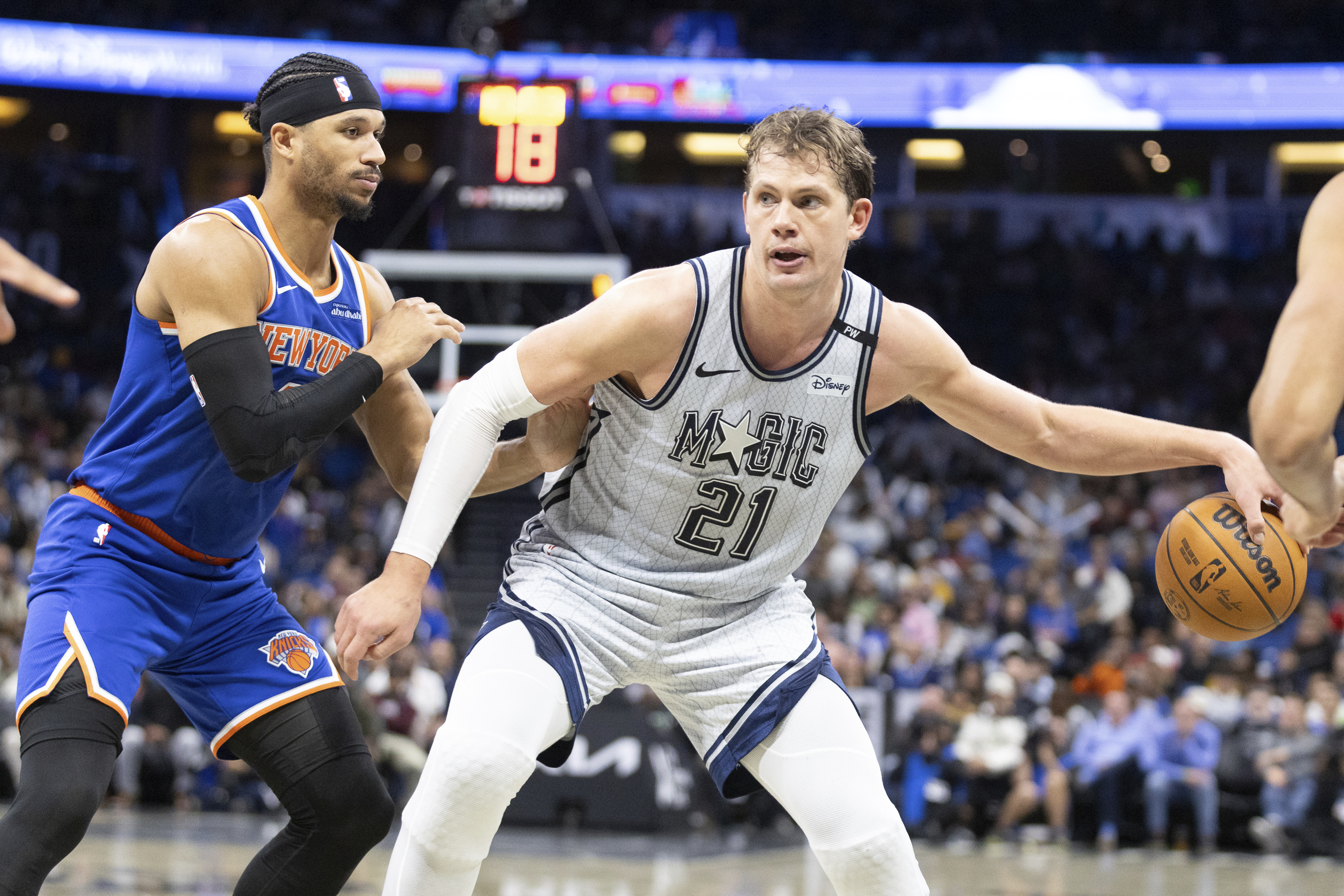 Orlando Magic center Moritz Wagner (21) evades New York Knicks guard Pacome Dadiet, left, during the second half of an NBA basketball game Sunday, Dec. 15, 2024, in Orlando, Fla.