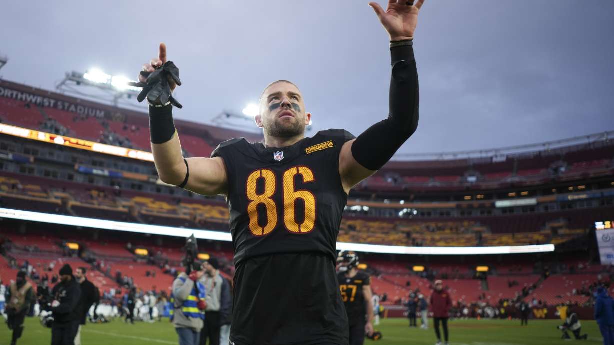 Washington Commanders tight end Zach Ertz (86) celebrates the team's 42-19 win against the Tennessee Titans in an NFL football game Sunday, Dec. 1, 2024, in Landover, Md.