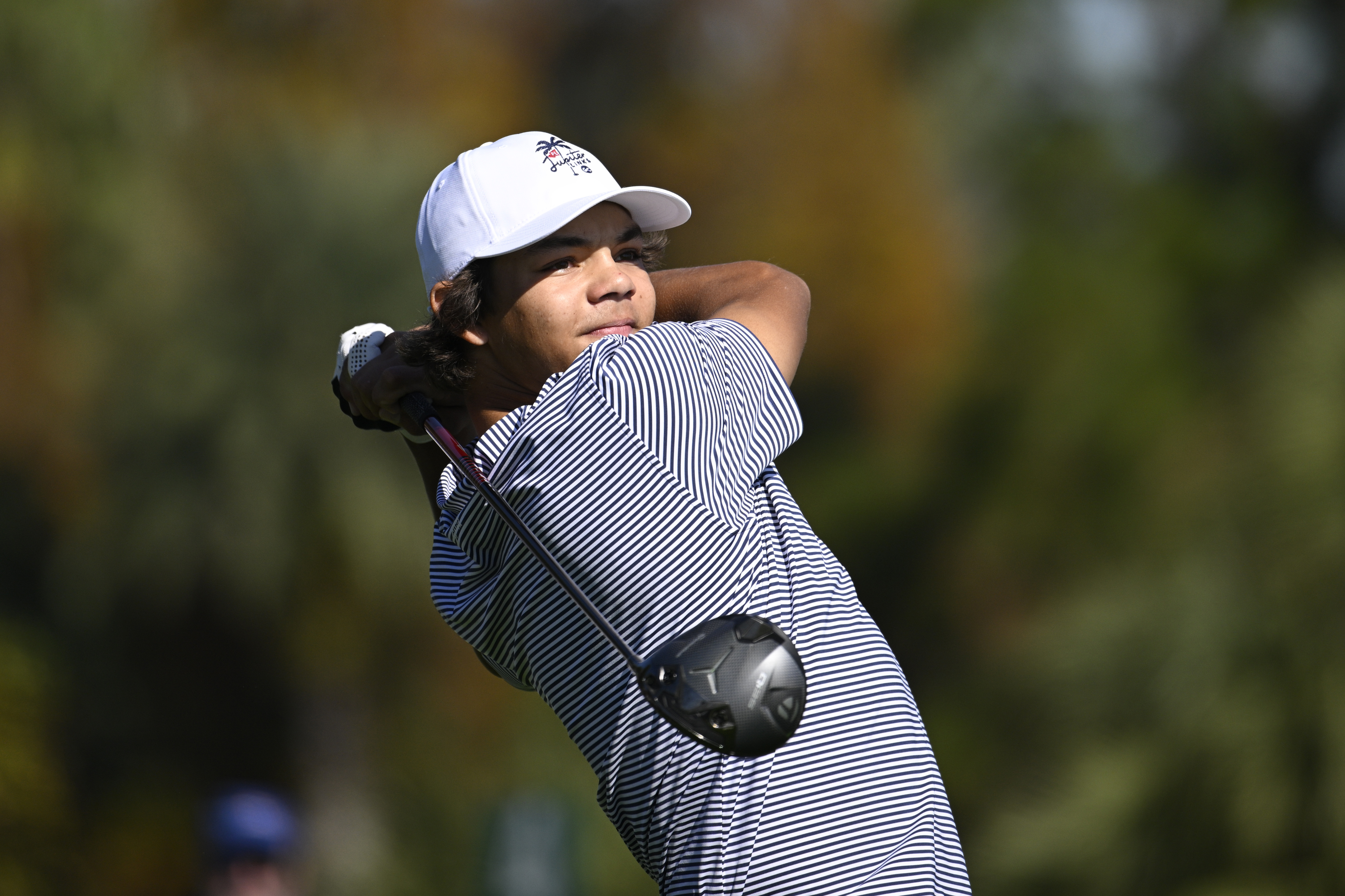 Charlie Woods tees off on the fifth hole during the first round of the PNC Championship golf tournament, Saturday, Dec. 21, 2024 in Orlando.