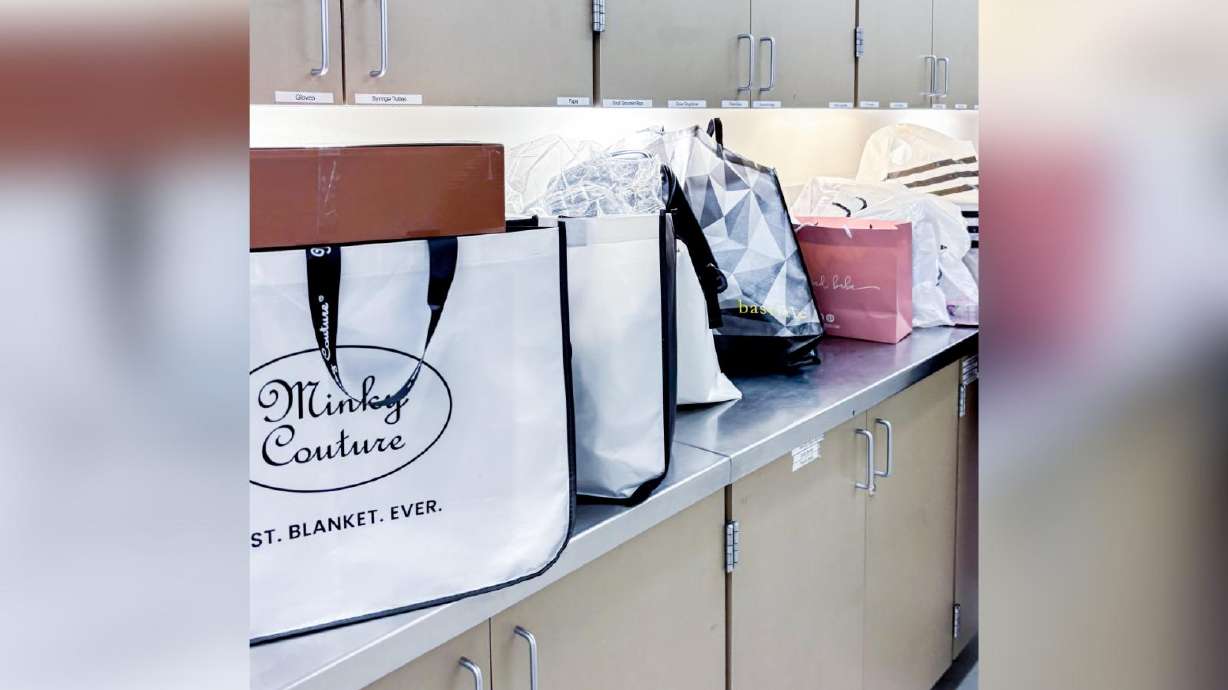 A photo of shopping bags allegedly stolen from cars in Salt Lake City and found on Sunday by police. Salt Lake police are warning people not to leave valuables in their cars after they arrested two men who are accused of stealing gifts from cars.