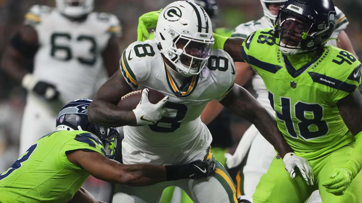 Green Bay Packers' Josh Jacobs runs during the first half of an NFL football game against the Seattle Seahawks Sunday, Dec. 15, 2024, in Seattle.