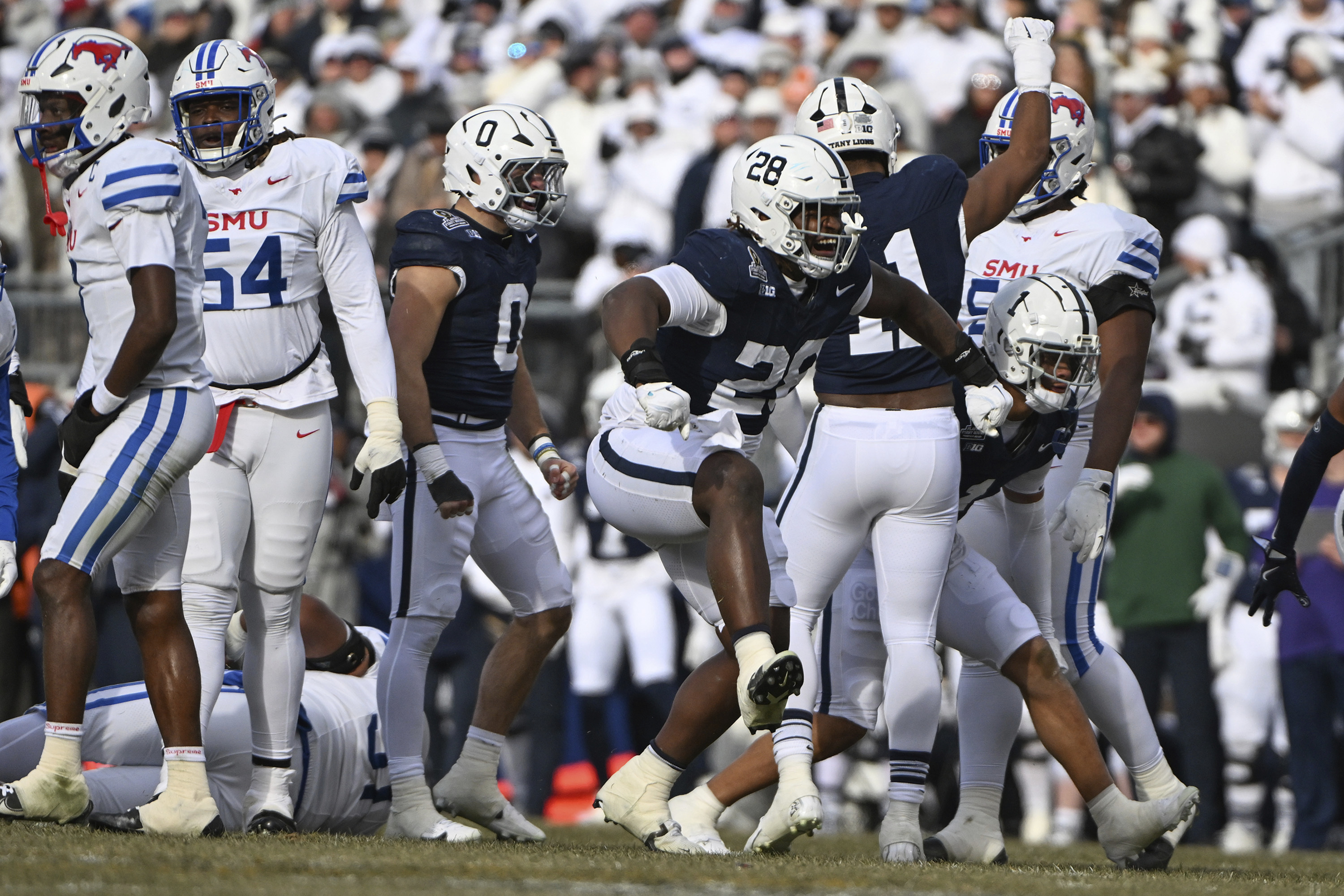 Penn State defensive tackle Zane Durant (28) celebrates a tackle against SMU during the first half in the first round of the NCAA College Football Playoff, Saturday, Dec. 21, 2024, in State College, Pa.