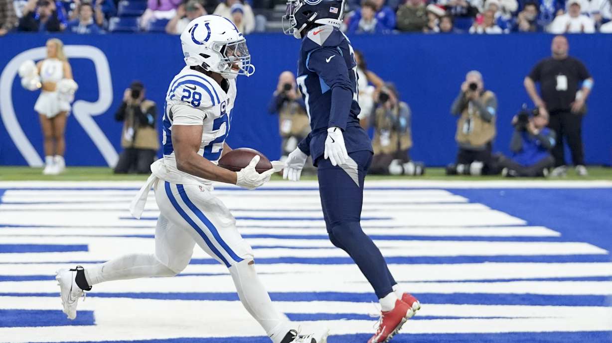 Indianapolis Colts running back Jonathan Taylor (28) scores a touchdown during the second half of an NFL football game against the Tennessee Titans, Sunday, Dec. 22, 2024, in Indianapolis.