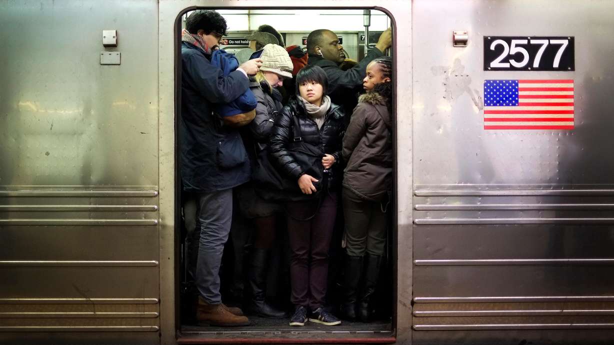 A female passenger died after being set on fire by a man on a New York City subway train Sunday morning, according to police. Police say they have arrested someone in connection with the killing.