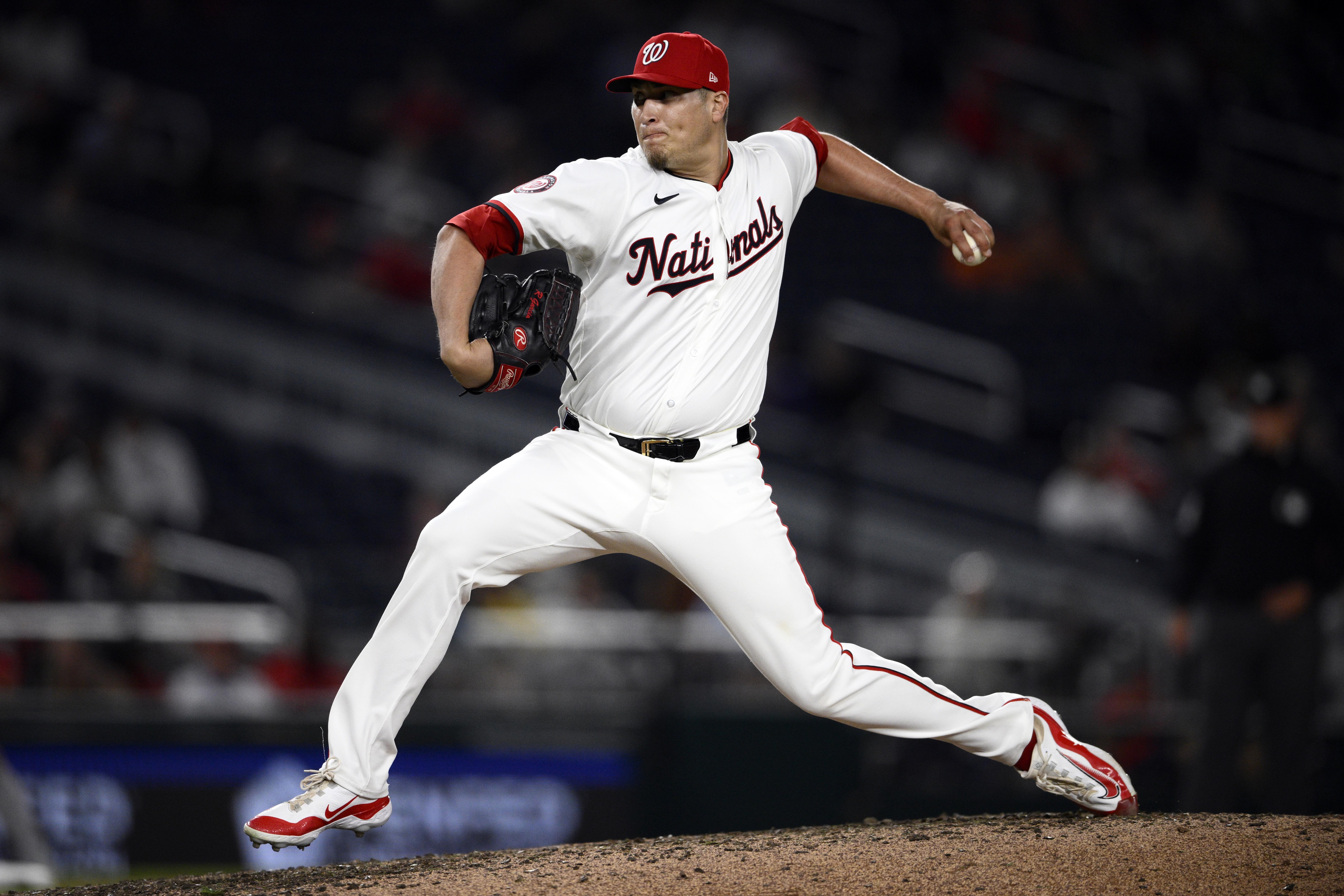 FILE - Washington Nationals relief pitcher Robert Garcia (61) in action during a baseball game against the Colorado Rockies, Aug. 20, 2024, in Washington.