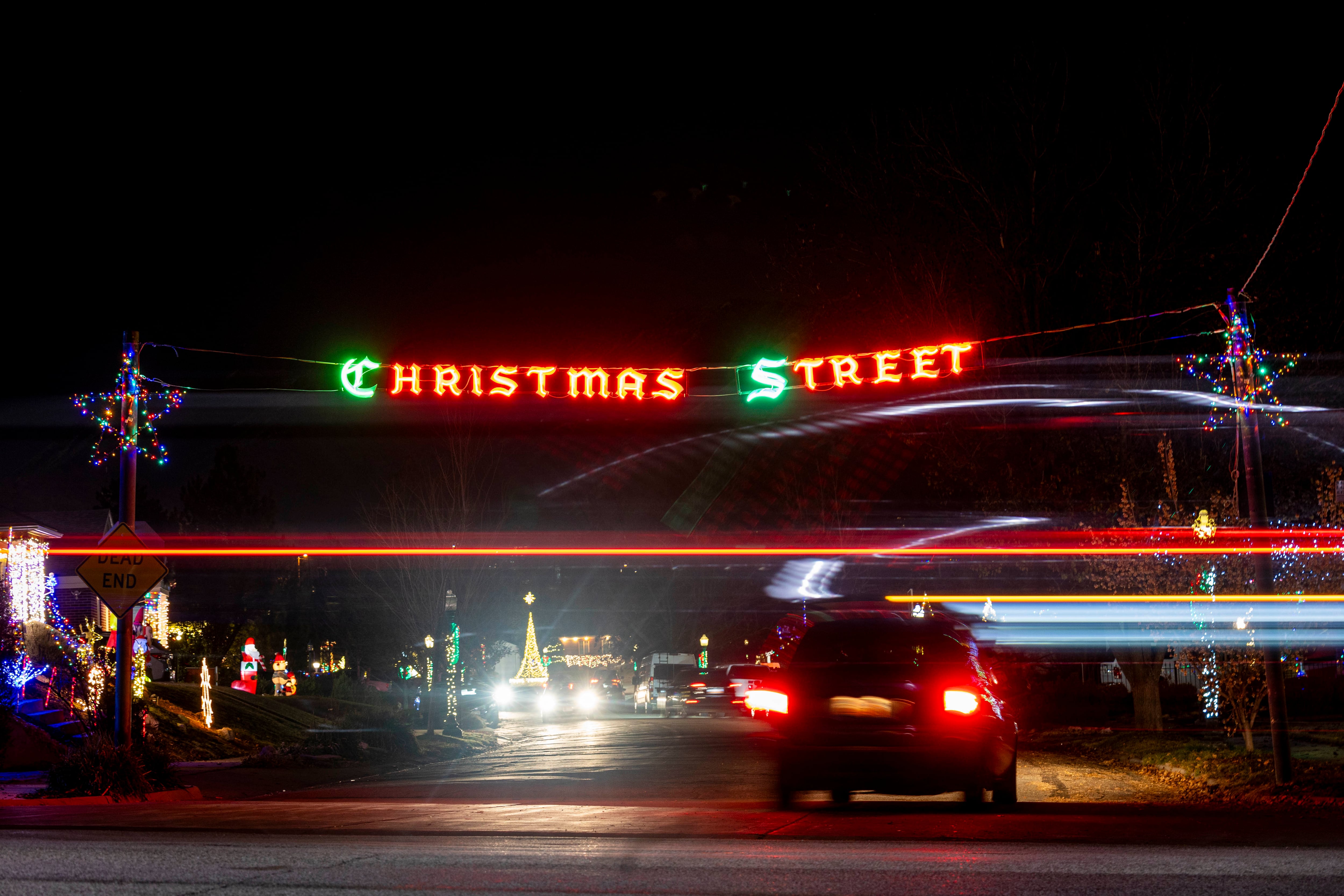 Traffic flows along 1500 East as a vehicle turns onto Glen Arbor Street, nicknamed “Christmas Street,” in Salt Lake City on Thursday, Dec. 12, 2024.