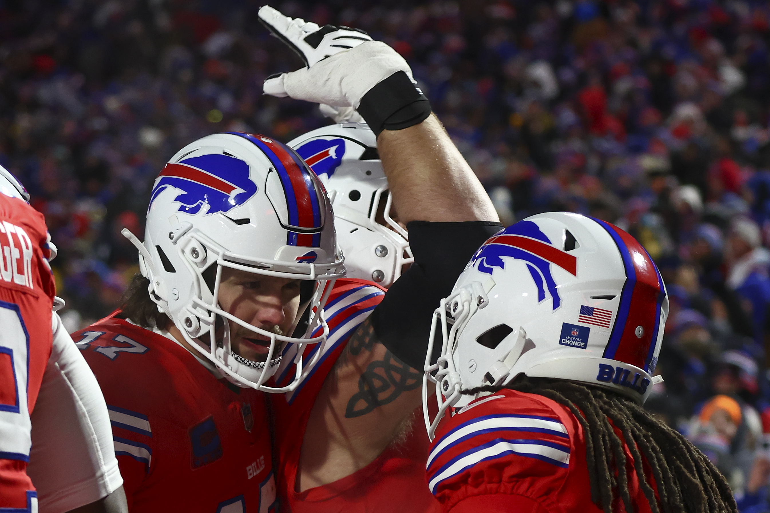 Buffalo Bills quarterback Josh Allen (17) congratulates Buffalo Bills running back James Cook (4) after a touchdown against the New England Patriots during the second quarter of an NFL football game, Sunday, Dec. 22, 2024, in Orchard Park, N.Y..