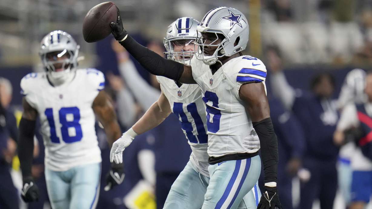 Dallas Cowboys' Donovan Wilson (6) celebrates with Nick Vigil (41) Wilson sacked Tampa Bay Buccaneers' Baker Mayfield (6) and recovered Mayfield's fumble in the second half of an NFL football game in Arlington, Texas, Sunday, Dec. 22, 2024.