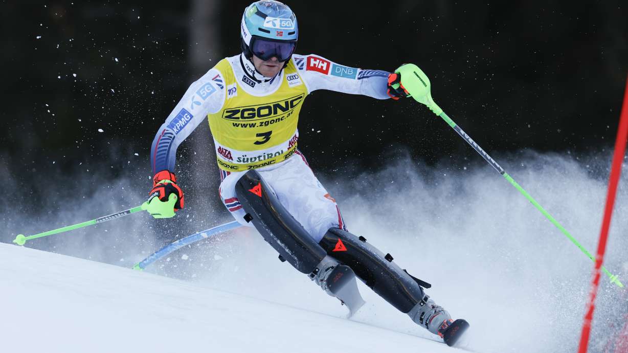 Norway's Timon Haugan speeds down the course during an alpine ski, men's World Cup slalom, in Alta Badia, Italy, Monday, Dec. 23, 2024.