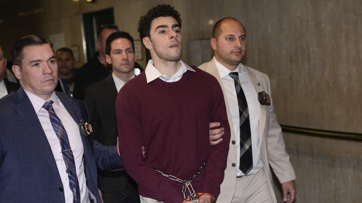 Luigie Mangione is escorted into Manhattan Criminal court for his arraignment on state murder and terror charges in the killing of UnitedHealthcare CEO Brian Thompson, Monday, in New York.