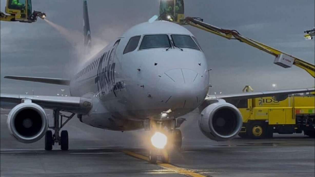Integrated Deicing Services' crews deice an aircraft at Salt Lake City International Airport. The Salt Lake City airport is the only one in the country that recycles deicing fluid, or propylene glycol, from start to finish.