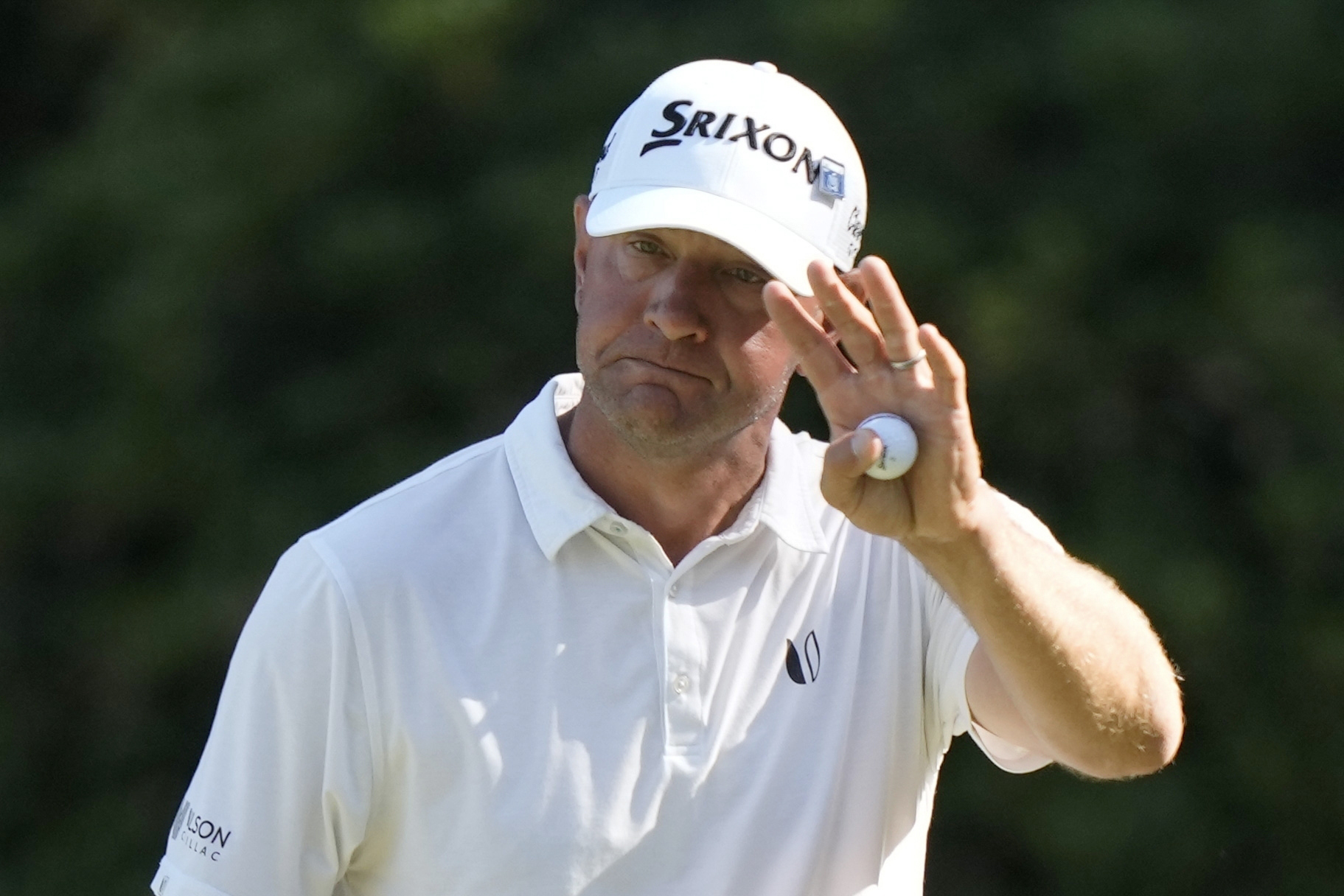 FILE - Lucas Glover waves after making a putt on the 13th hole during third round at the Masters golf tournament at Augusta National Golf Club Saturday, April 13, 2024, in Augusta, Ga.