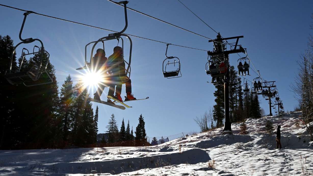 Skiers and snowboarders ride the lift during a limited opening at Solitude Mountain Resort on Friday, Nov. 8, 2024.
