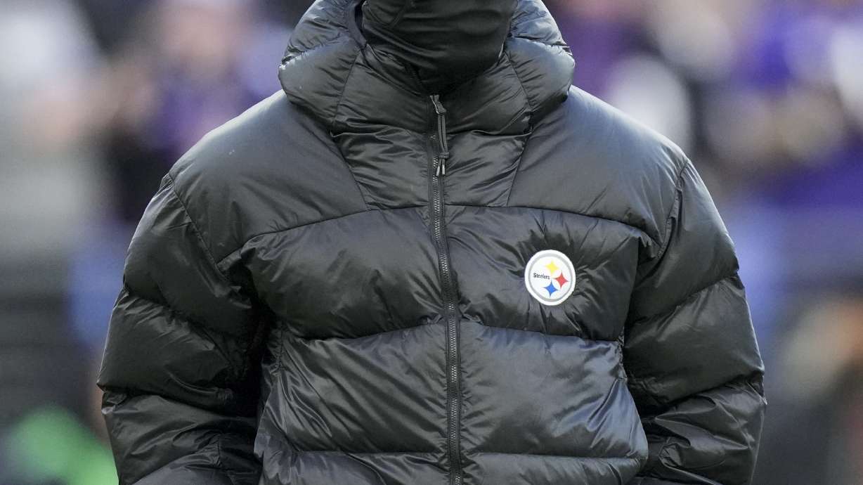 Pittsburgh Steelers wide receiver George Pickens walks on the field as teammates work out prior to an NFL football game against the Baltimore Ravens, Saturday, Dec. 21, 2024, in Baltimore.