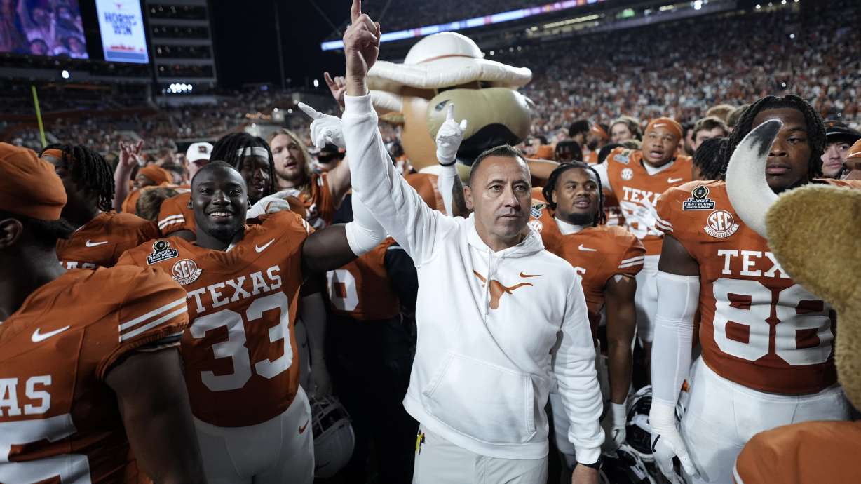 Texas head coach Steve Sarkisian celebrates with his team after a first round game against Clemson in the College Football Playoff, Saturday, Dec. 21, 2024, in Austin, Texas.