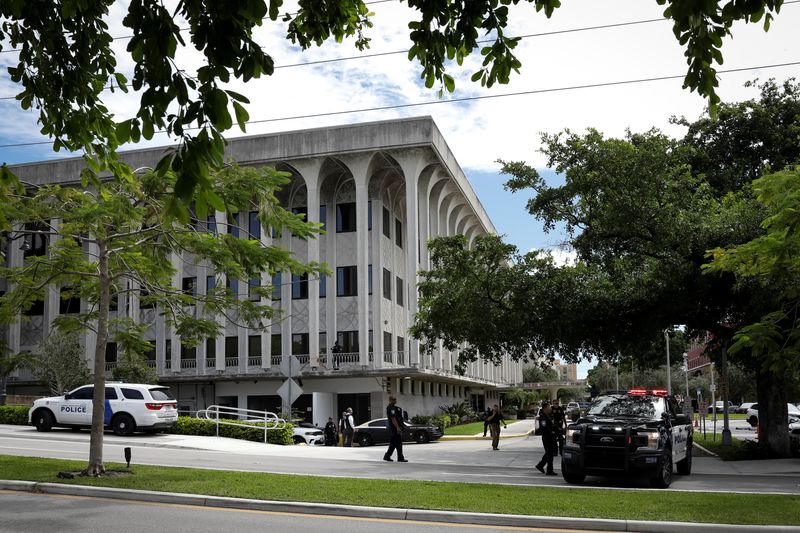 A law enforcement motorcade, presumably carrying the suspect in an apparent assassination attempt on then Republican presidential nominee Donald Trump, is seen in West Palm Beach, Fla., Sept. 23, 2024. Ryan Routh's trial begins with jury selection on Monday. 