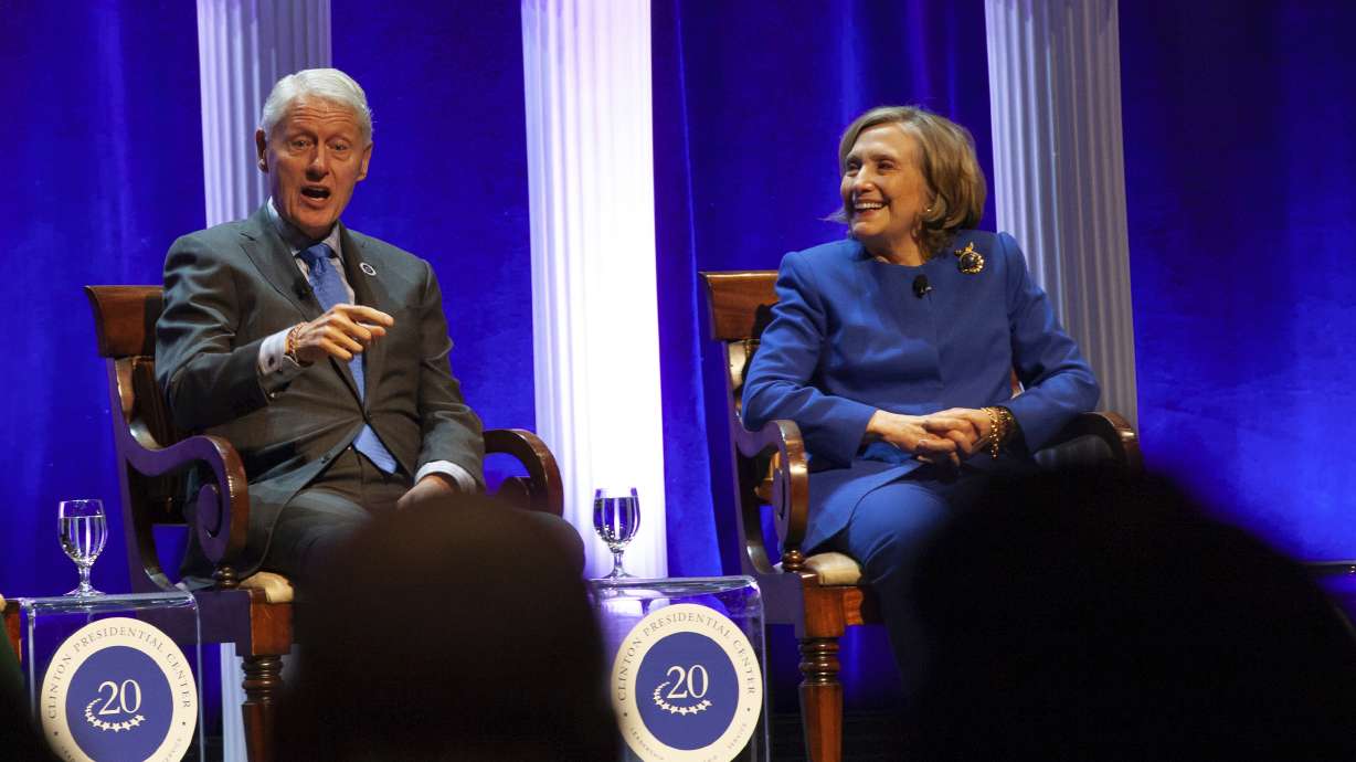 Former President Bill Clinton and former Secretary of State Hillary Rodham Clinton respond to audience questions on Dec. 7, in Little Rock, Ark. Bill Clinton was admitted to a hospital Monday after developing a fever.