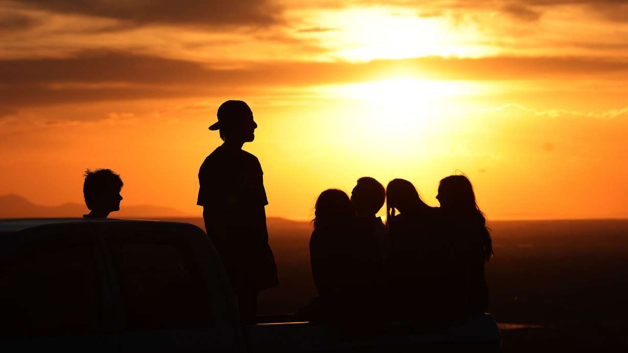 Teenagers watch the sunset from their pickup truck in Holladay on June 13. Utah continues to place first in the category of states with the fewest teenage drinkers. This doesn't mean there aren't teens that drink, and drink a lot.