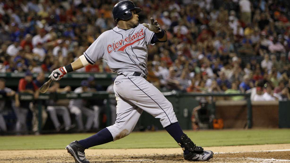 FILE - Cleveland Indians catcher Carlos Santana during a baseball game against the Texas Rangers, July 7, 2010 in Arlington, Texas.
