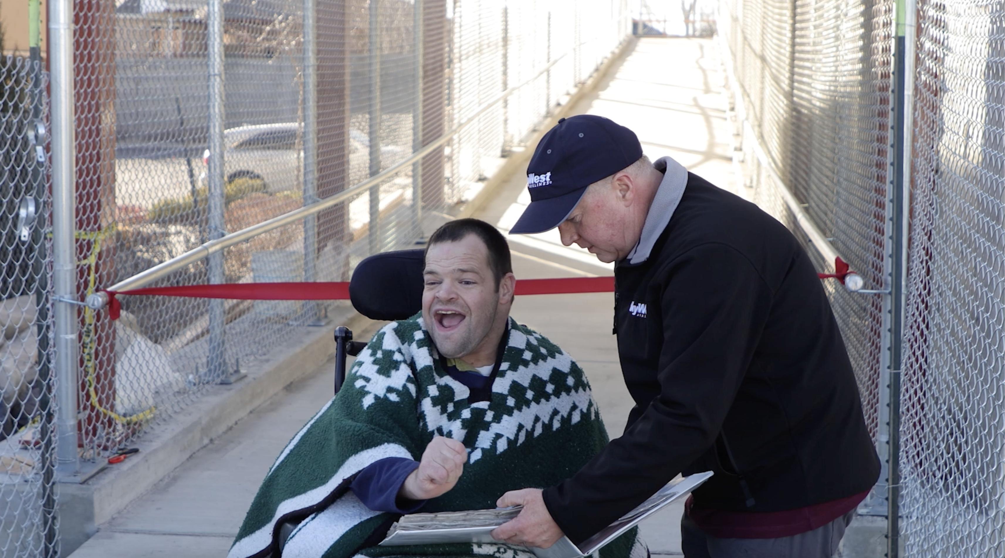 Jacob Chesley communicates his thanks after getting to cross a new pedestrian bridge in South Jordan on Dec. 21.