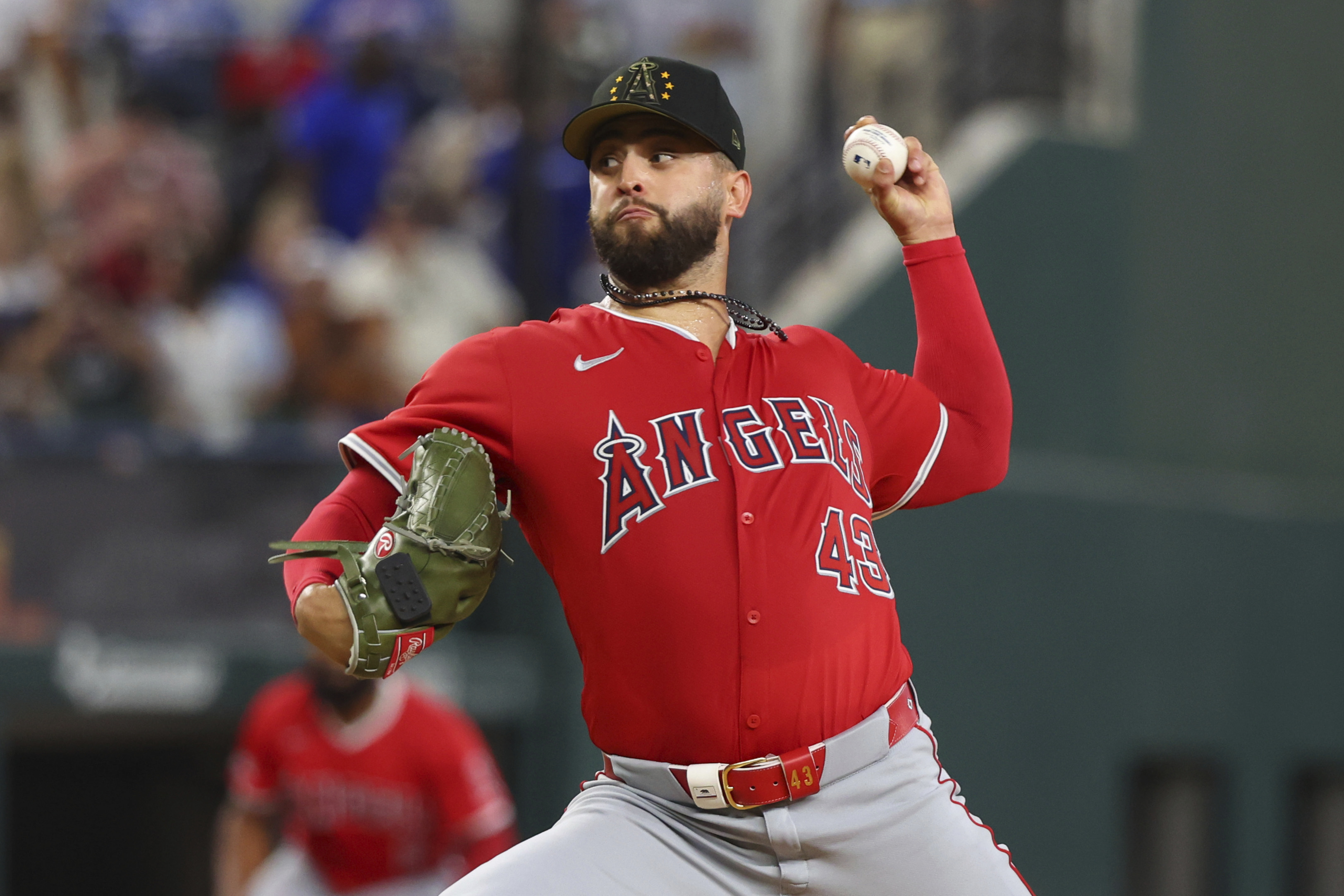 FILE - Los Angeles Angels starting pitcher Patrick Sandoval (43) delivers against the against the Texas Rangers in the third inning of a baseball game Saturday, May 18, 2024, in Arlington, Texas.
