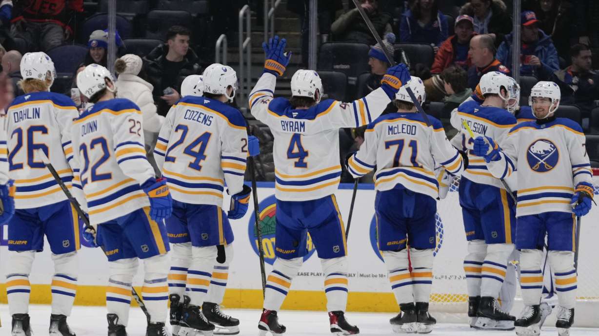 The Buffalo Sabres celebrate after an NHL hockey game against the New York Islanders Monday, Dec. 23, 2024, in Elmont, N.Y.