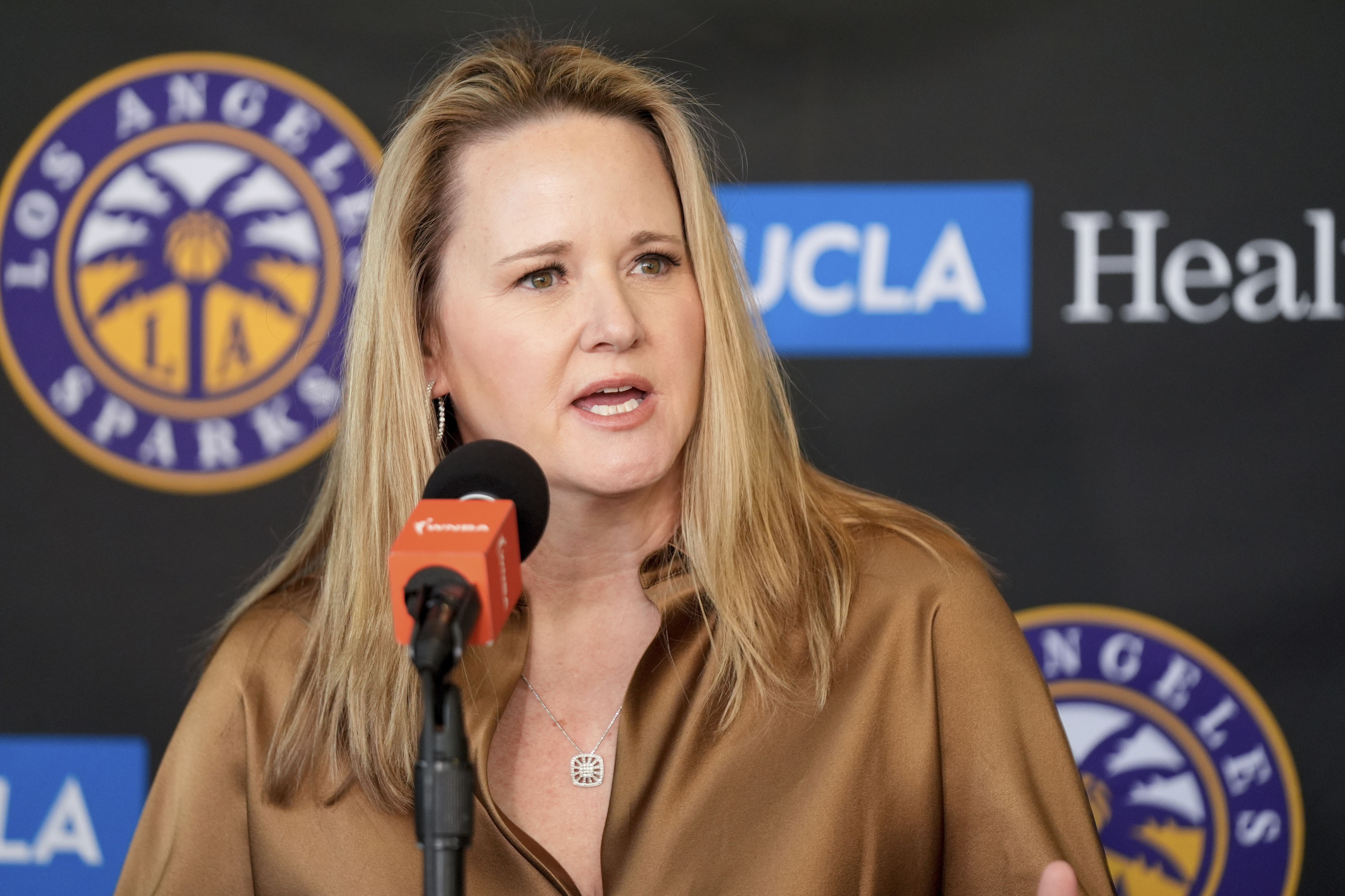 FILE - New Los Angeles Sparks head coach Lynne Roberts fields questions during a news conference for the WNBA basketball team Nov. 21, 2024, in Los Angeles.