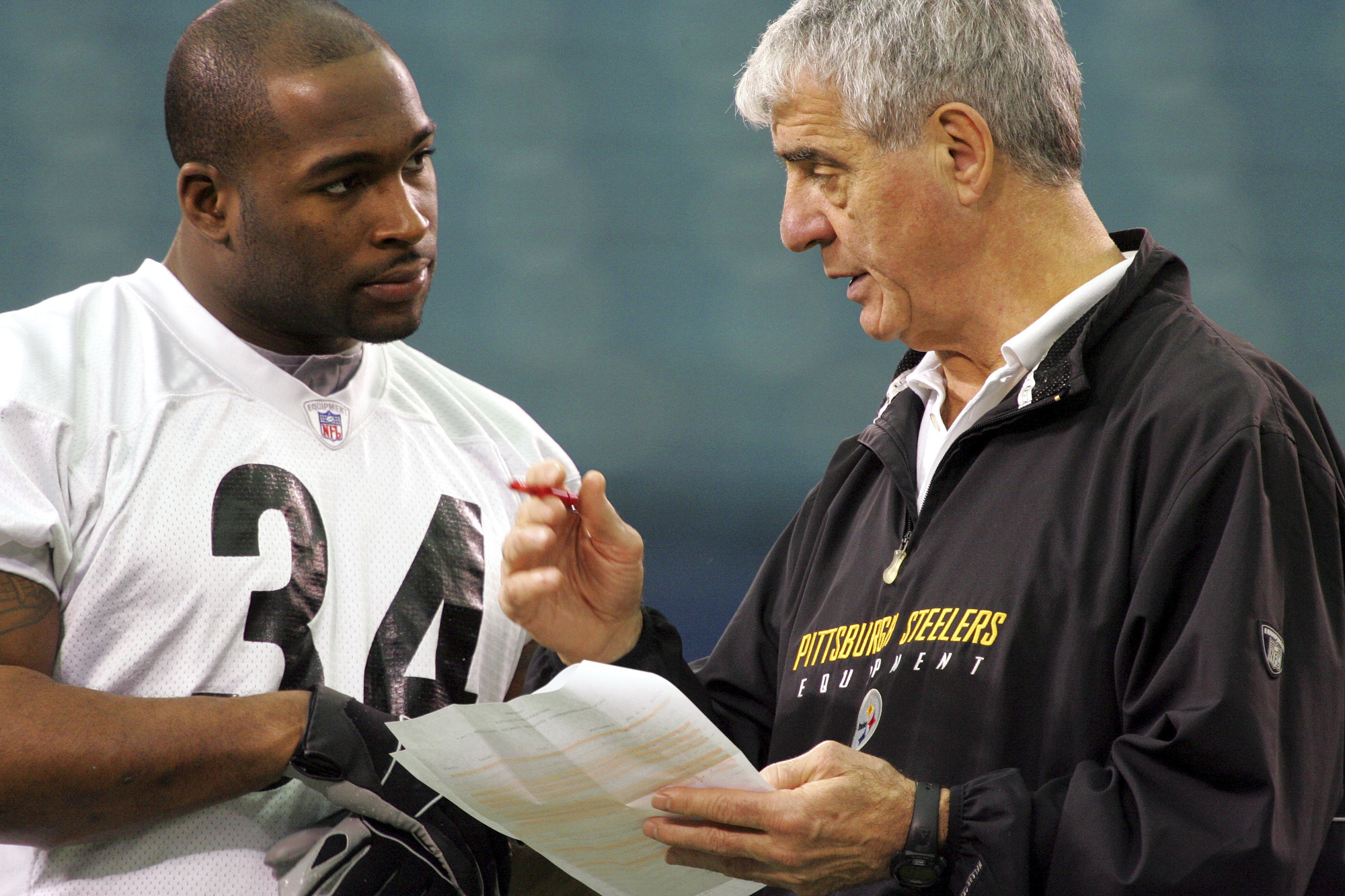 FILE - Pittsburgh Steelers running backs coach Dick Hoak, in his 34th season as a Steelers assistant coach, talks with running back Verron Haynes before a team workout at the Pontiac Silverdom, Feb. 1, 2006 in Pontiac, Mich.