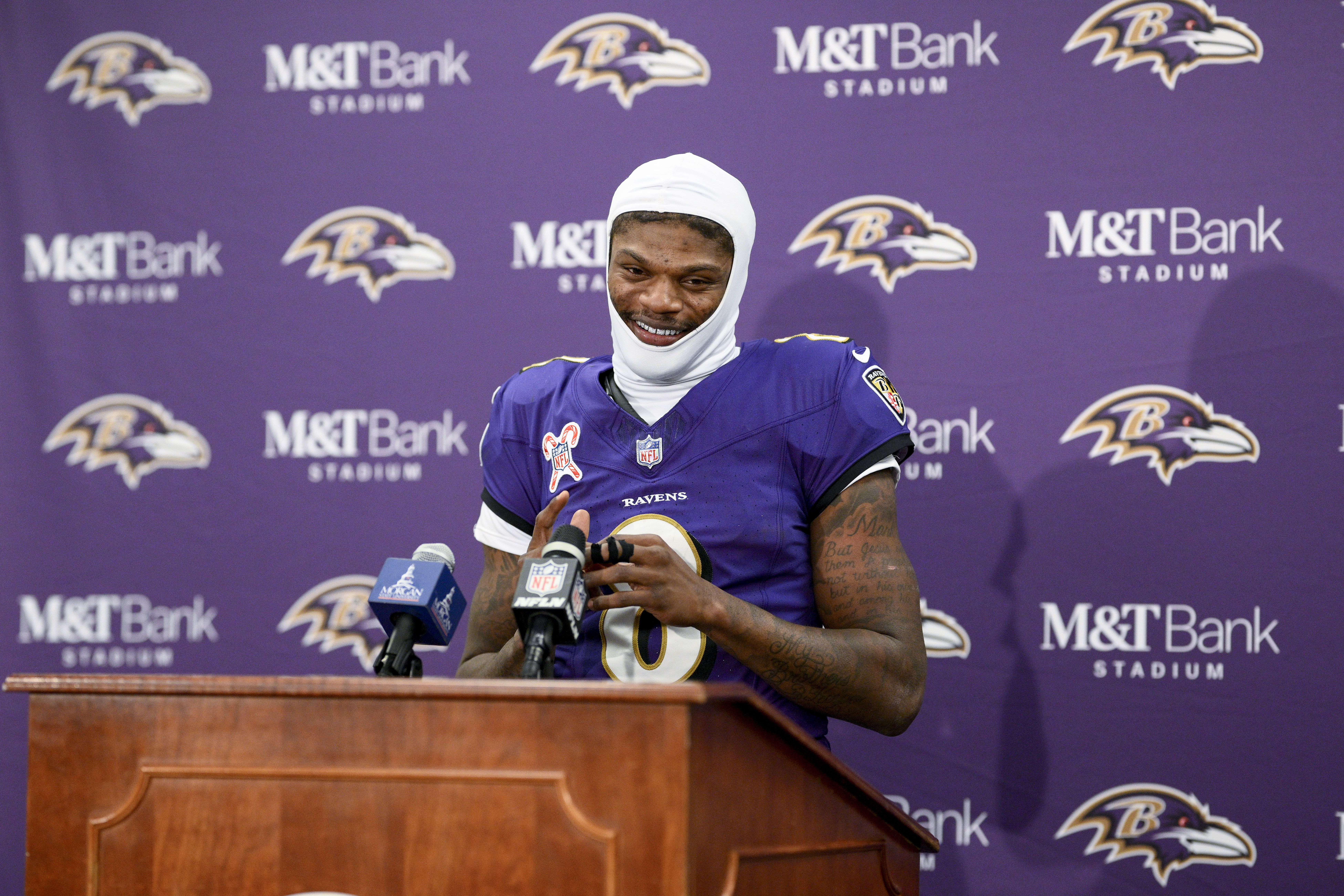 Baltimore Ravens quarterback Lamar Jackson talks to reporters following an NFL football game against the Pittsburgh Steelers, Saturday, Dec. 21, 2024, in Baltimore. The Ravens won 34-17.