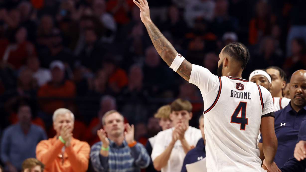 Auburn forward Johni Broome waves to fans as he checks out of the game during the second half of an NCAA college basketball game against Purdue, Saturday, Dec. 21, 2024, in Birmingham, Ala.